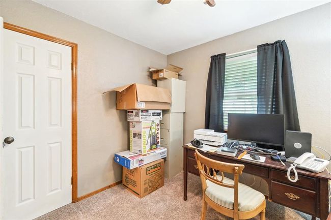 Office space featuring light colored carpet and a ceiling fan | Image 32