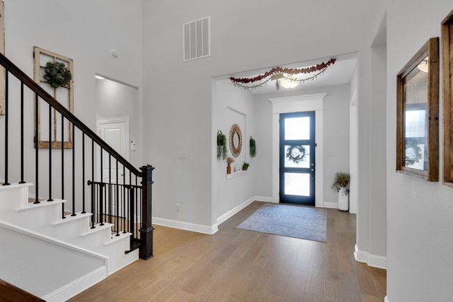Corridor featuring stairs and light wood finished floors | Image 5