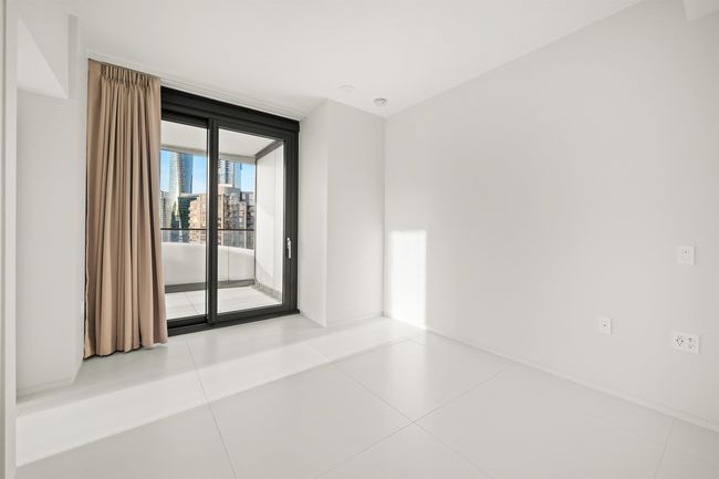 Tiled spare room featuring baseboards and expansive windows | Image 9