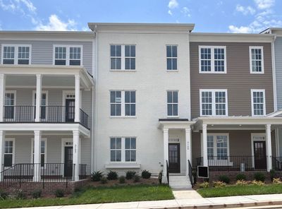 This townhome has a Gorgeous White Painted Brick Front. | Image 1