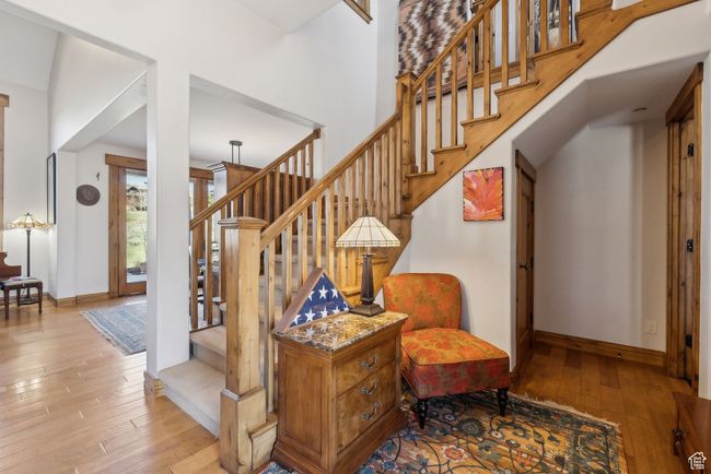 Stairway with wood-type flooring and baseboards | Image 21