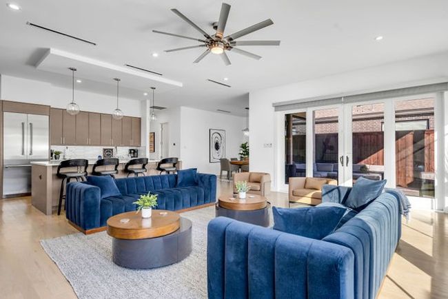 Living room featuring ceiling fan, a healthy amount of sunlight, french doors, and light hardwood / wood-style flooring | Image 11