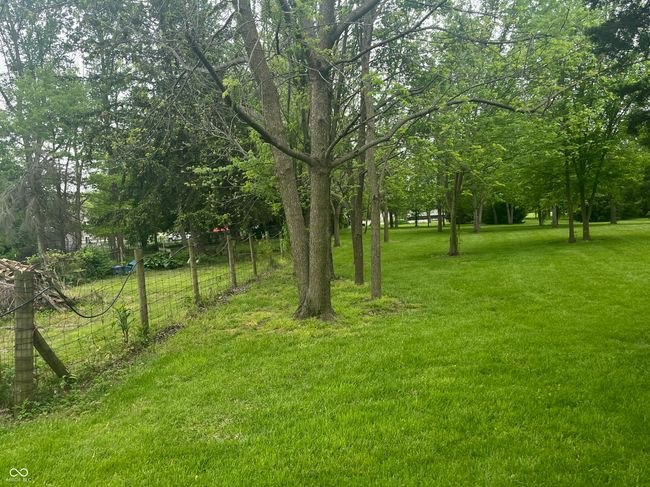 view of grassy yard and fence | Image 36