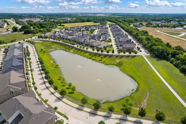 Aerial view of residential area with a large body of water | Image 32
