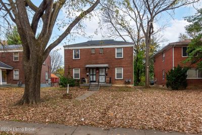 Brick Duplex - newer roof, interior updates, fully rented. Set back from the street | Image 1