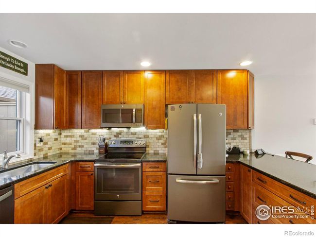 This U shaped kitchen has a lot of storage in this gorgeous mountain home. | Image 6