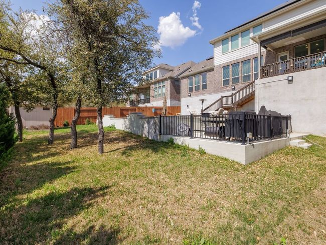 View of yard with a residential view and fence | Image 33