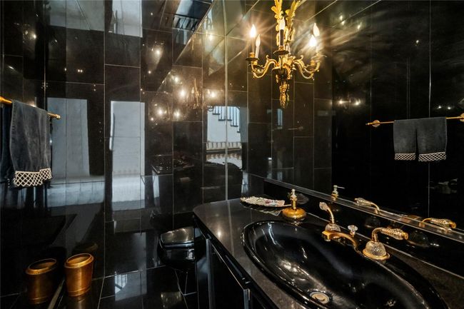 Bathroom featuring vanity, toilet, and a tile shower | Image 11