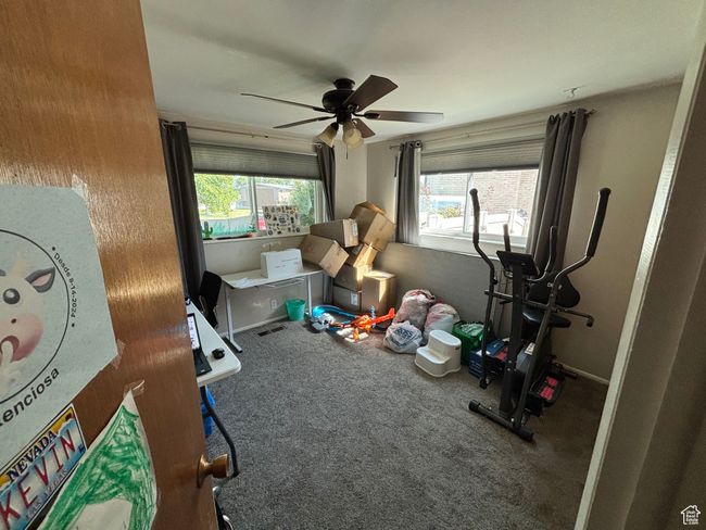 Bedroom featuring carpet flooring and ceiling fan | Image 13