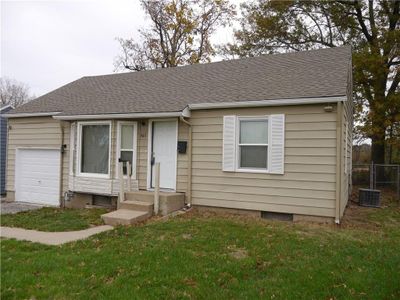 View of front facade featuring a garage and a front yard | Image 2