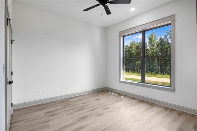 Spare room with light wood-type flooring, ceiling fan, and recessed lighting | Image 36
