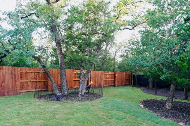 View of fenced backyard | Image 29