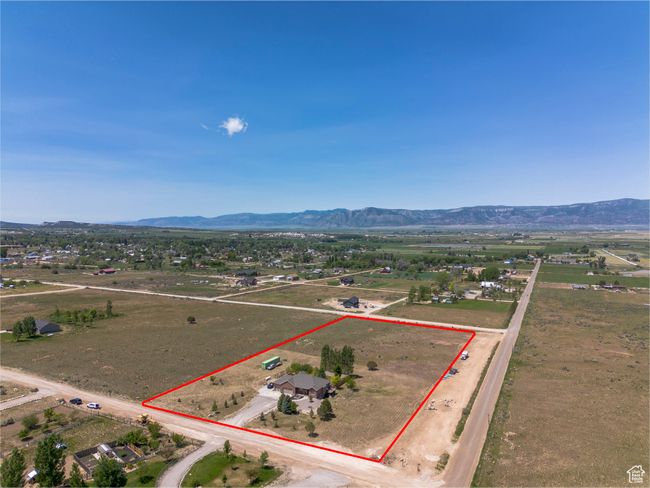 Overview of rural landscape with a mountainous background and property boundaries highlighted | Image 48