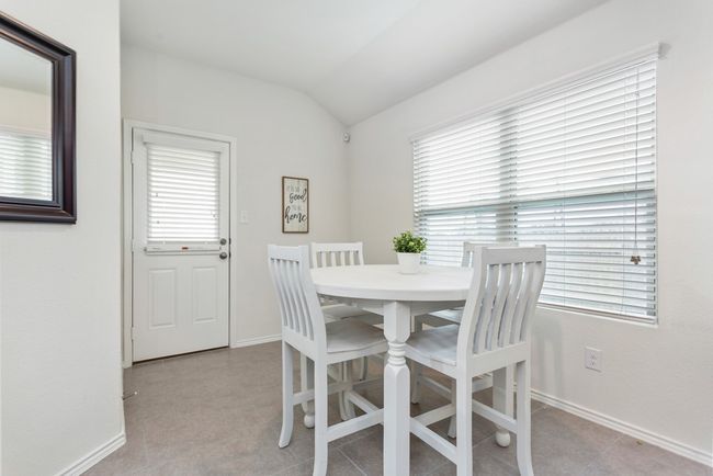 The dining area is a great space with lots of windows for natural light! | Image 9