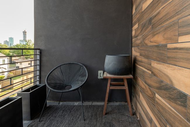 Balcony featuring a view of city | Image 27