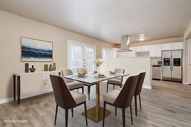 Dining room featuring light wood-style flooring and baseboards | Image 10