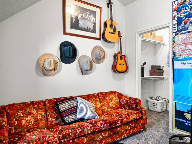 Carpeted living room featuring a textured ceiling | Image 22