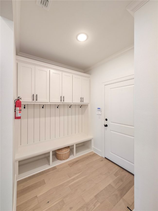 Mudroom featuring ornamental molding and light wood-style floors | Image 33