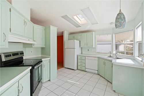 428 Papaya Cir, Barefoot Bay, FL, 32976-6853 | Card Image