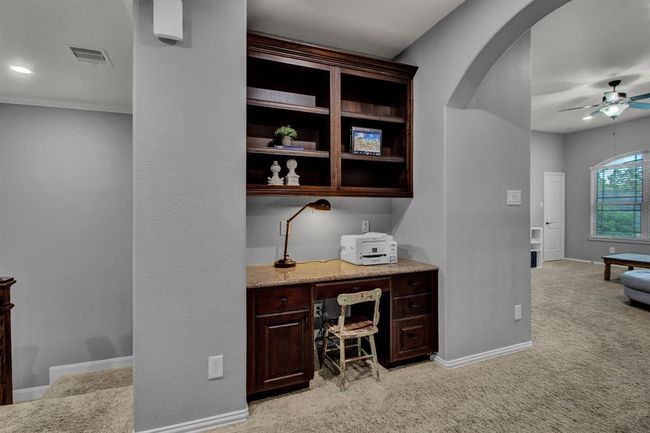 Built-in workspace upstairs is a great place to do homework or catch up on paperwork. | Image 27