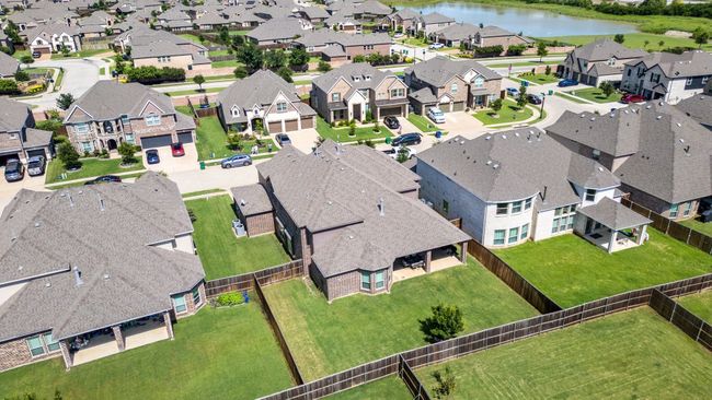 Aerial perspective of suburban area with a nearby body of water | Image 40