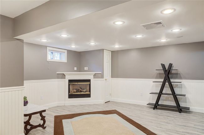 Finished Room in basement with Fireplace | Image 34