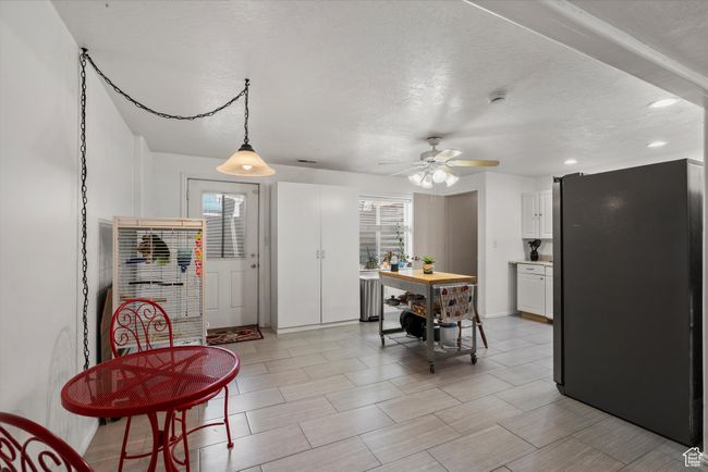 Dining room featuring a textured ceiling, recessed lighting, and a ceiling fan | Image 22