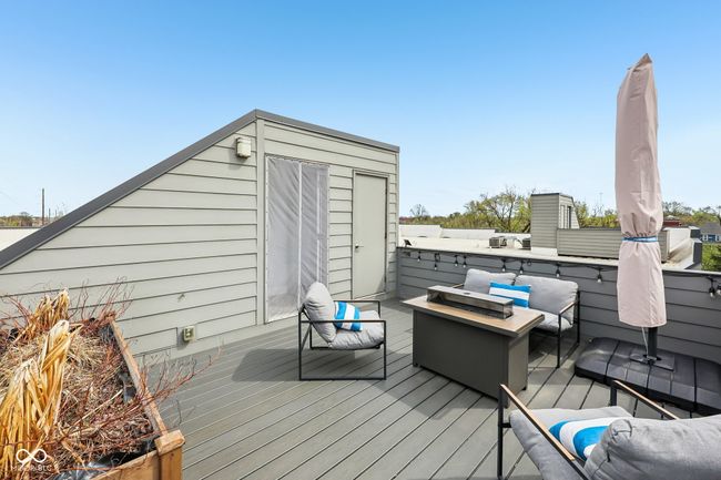 wooden terrace featuring an outdoor hangout area | Image 21