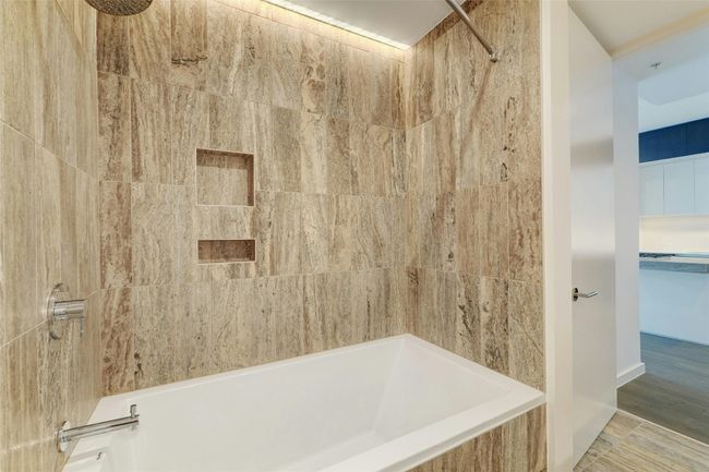 Bathroom featuring shower / bathing tub combination | Image 26