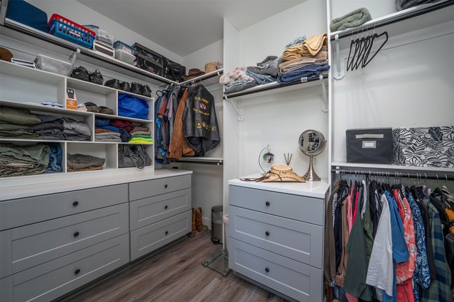 Walk in closet featuring built-in organizers | Image 26