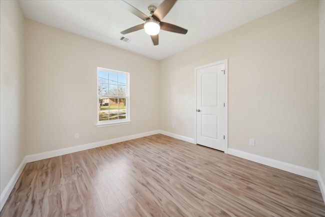 Spare room featuring ceiling fan and light hardwood / wood-style flooring | Image 14