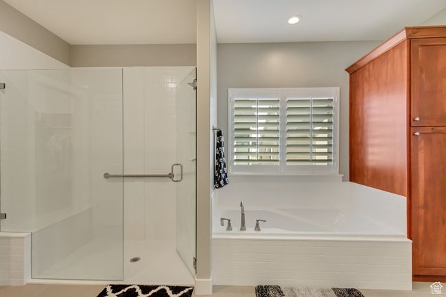 Bathroom with a bath, recessed lighting, and a shower stall | Image 19