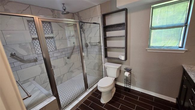 Upgraded Full bath featuring vanity and a shower stall | Image 9