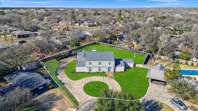 Aerial view of residential area with property parcel outlined and a pool | Image 37