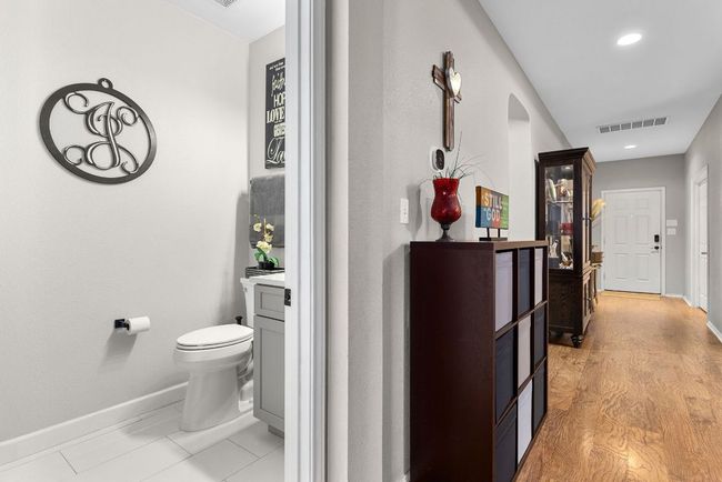 Corridor featuring baseboards, recessed lighting, and arched walkways | Image 33