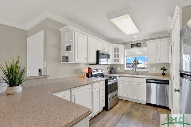Updated Kitchen with Stainless Steel Appliances & Breakfast Bar | Image 12