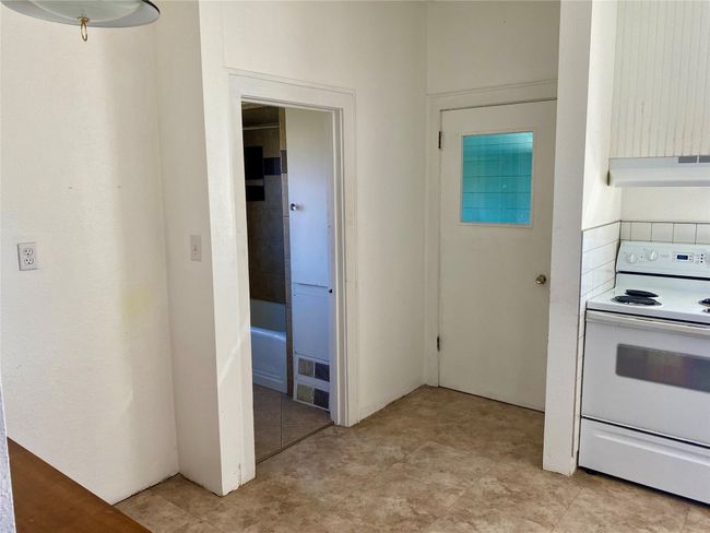 Kitchen facing bathroom and laundry room | Image 12
