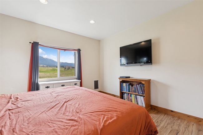 Bedroom featuring baseboards, recessed lighting, and wood finished floors | Image 32