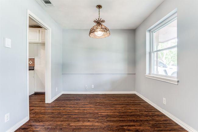 Empty room featuring wood finished floors and baseboards | Image 10