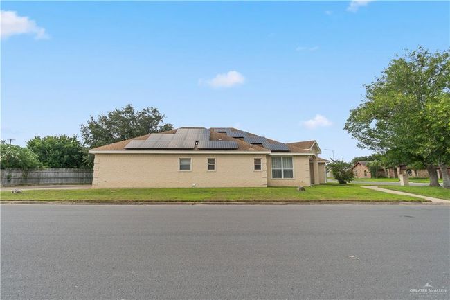 View of side of property featuring roof mounted solar panels | Image 25