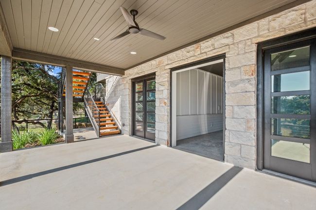 Lower level patio is complete with ceiling fan. | Image 28