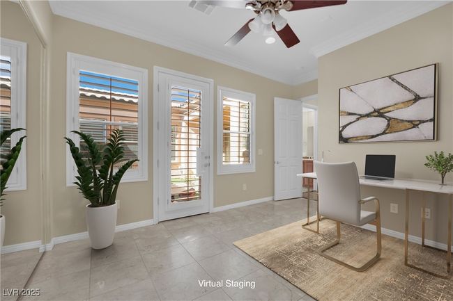 Office featuring crown molding, light tile patterned floors, a ceiling fan, and baseboards | Image 20