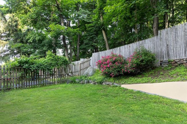 View of fenced backyard | Image 24