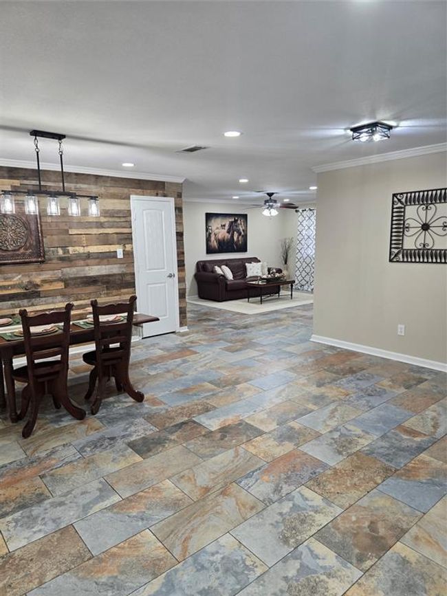 View from back door through dining area. Plenty of room on the wall to the right for a desk or china cabinet. | Image 29
