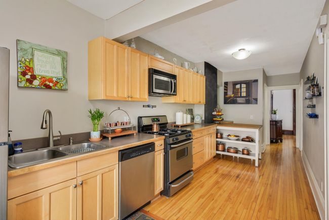 The kitchen includes a breakfast nook and the perpendicular table is included. | Image 16