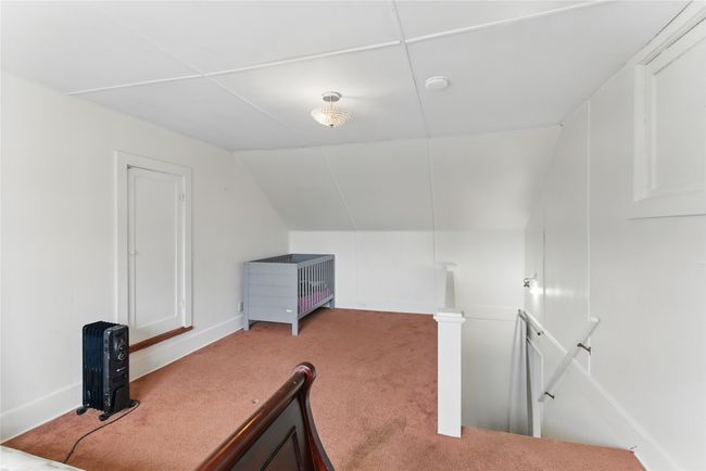 Additional living space with vaulted ceiling and carpet | Image 21