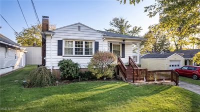 Bungalow-style home with a front yard | Image 1