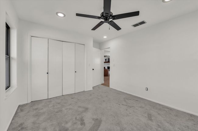 Unfurnished bedroom featuring recessed lighting, carpet, and visible vents | Image 33