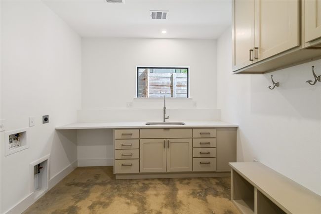 Laundry room located on the lower level | Image 28