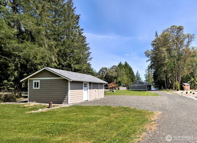 Private well and well house with additional double doors to roomy storage space. | Image 27